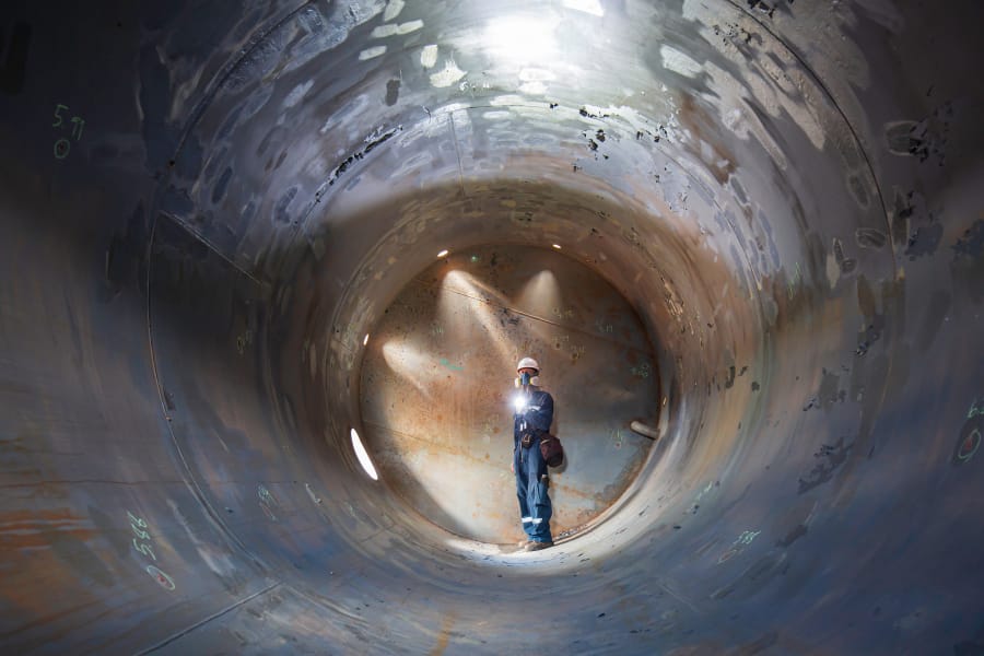 worker standing in a confined space