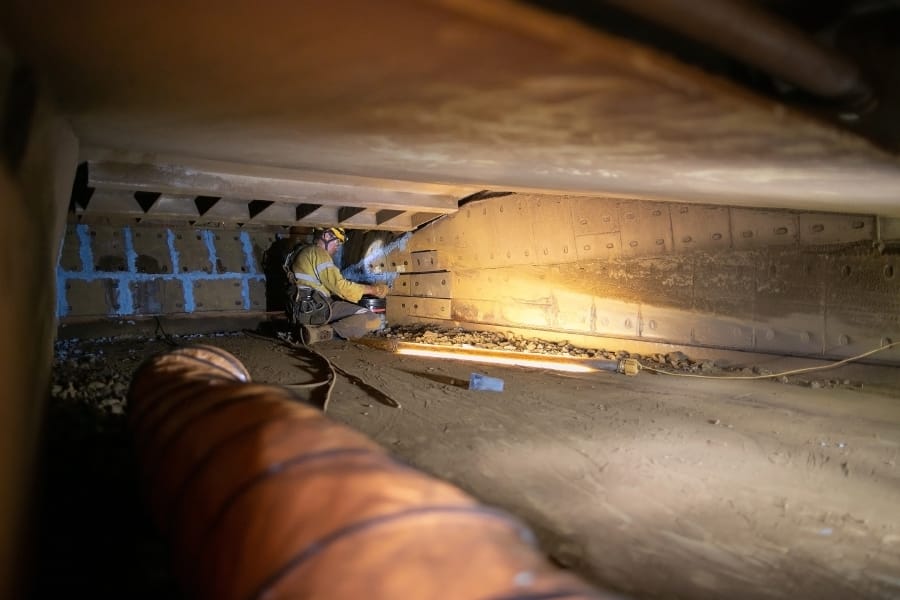 man working in a confined space