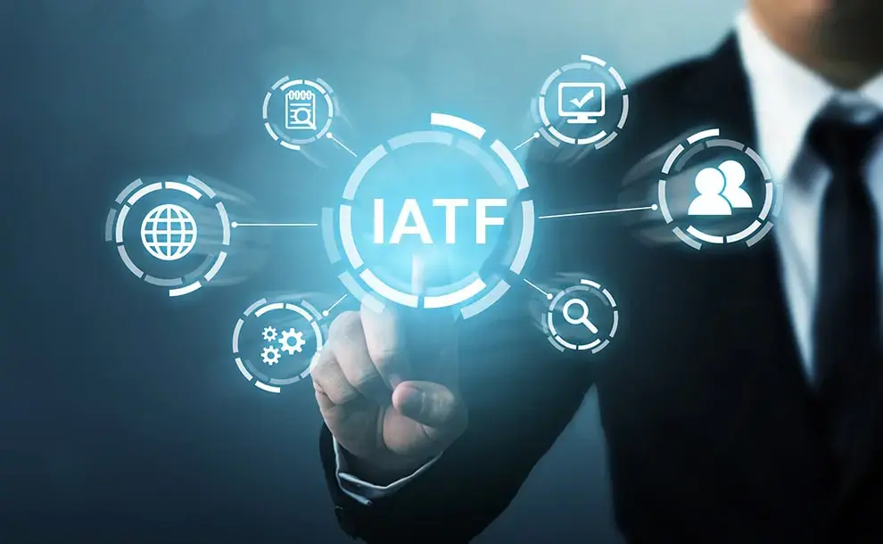 businessman pointing to overlay graphic representing the IATF standard