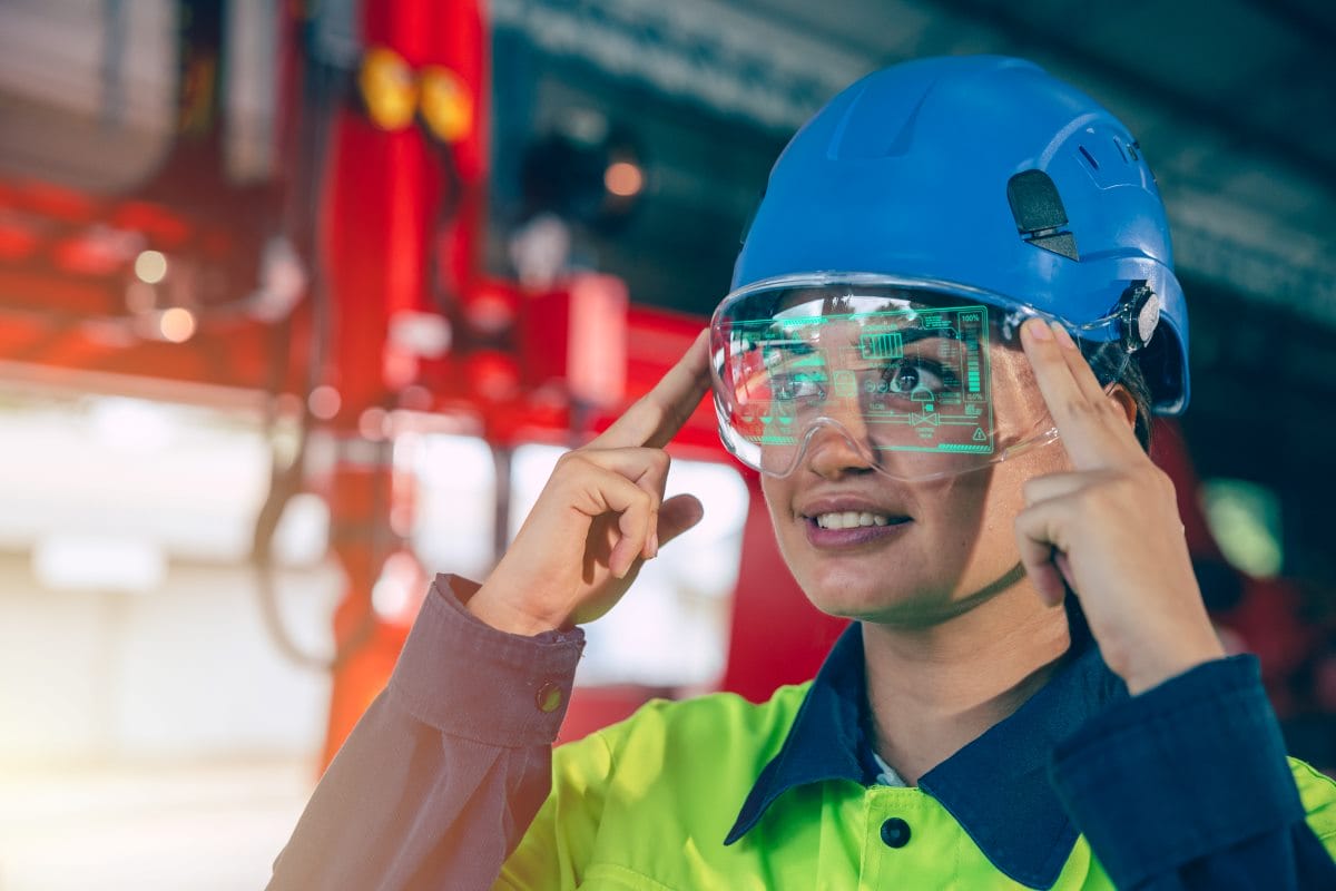 Construction worker using wearable technology safety glasses on the job site