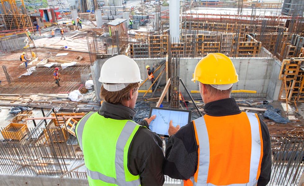 construction workers wearing hard hats at a construction site